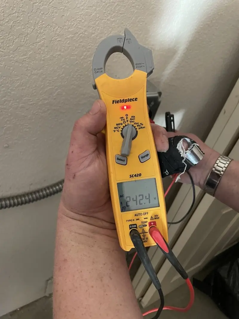 Voltage testing with clamp meter during Hot Tub / Pool Electrical Wiring in Madison